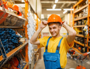 Male builder trying on helmet in hardware store 2021 08 30 02 17 47 utc - Polc és pályarendszer építő